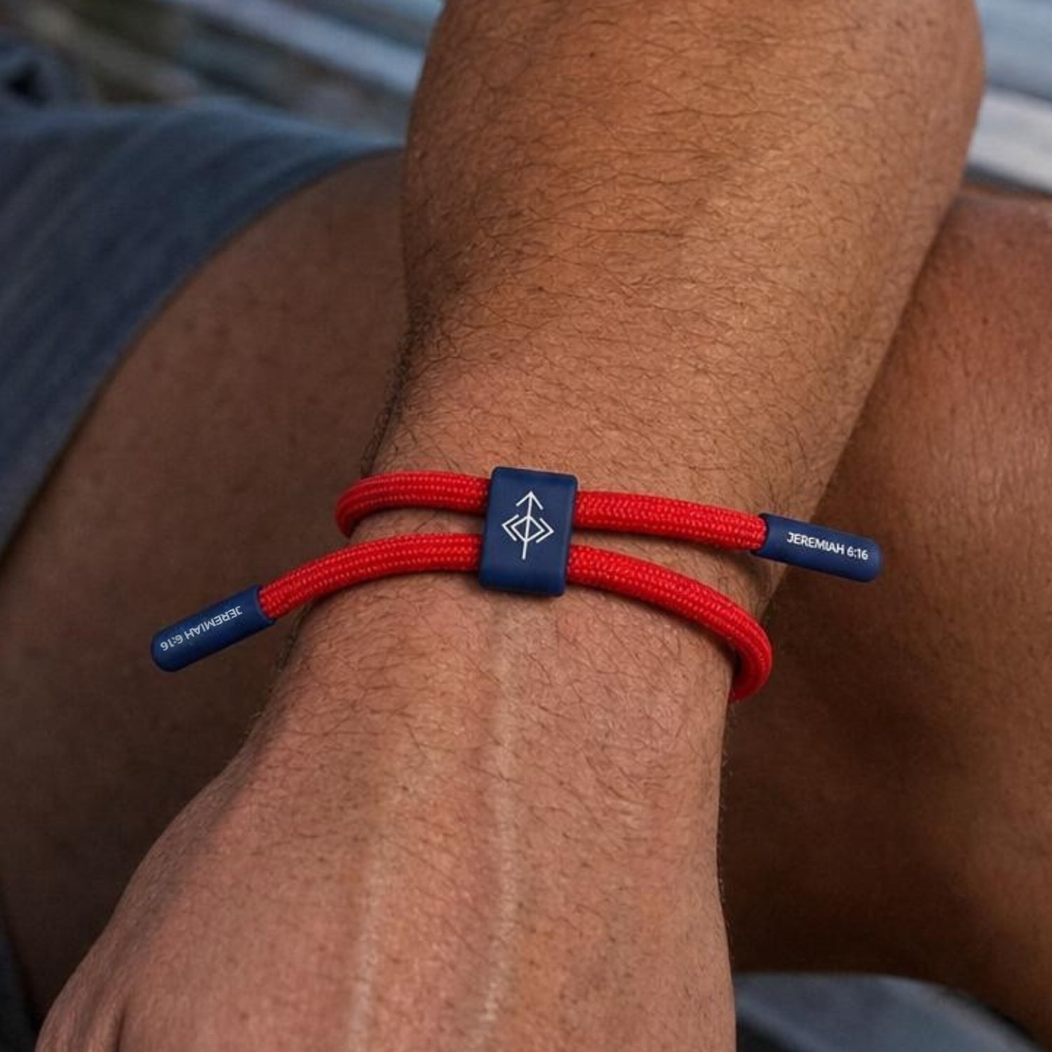 Seek Wisdom bracelet with red cord and navy accents featuring Jeremiah 6:16 verse packaging
