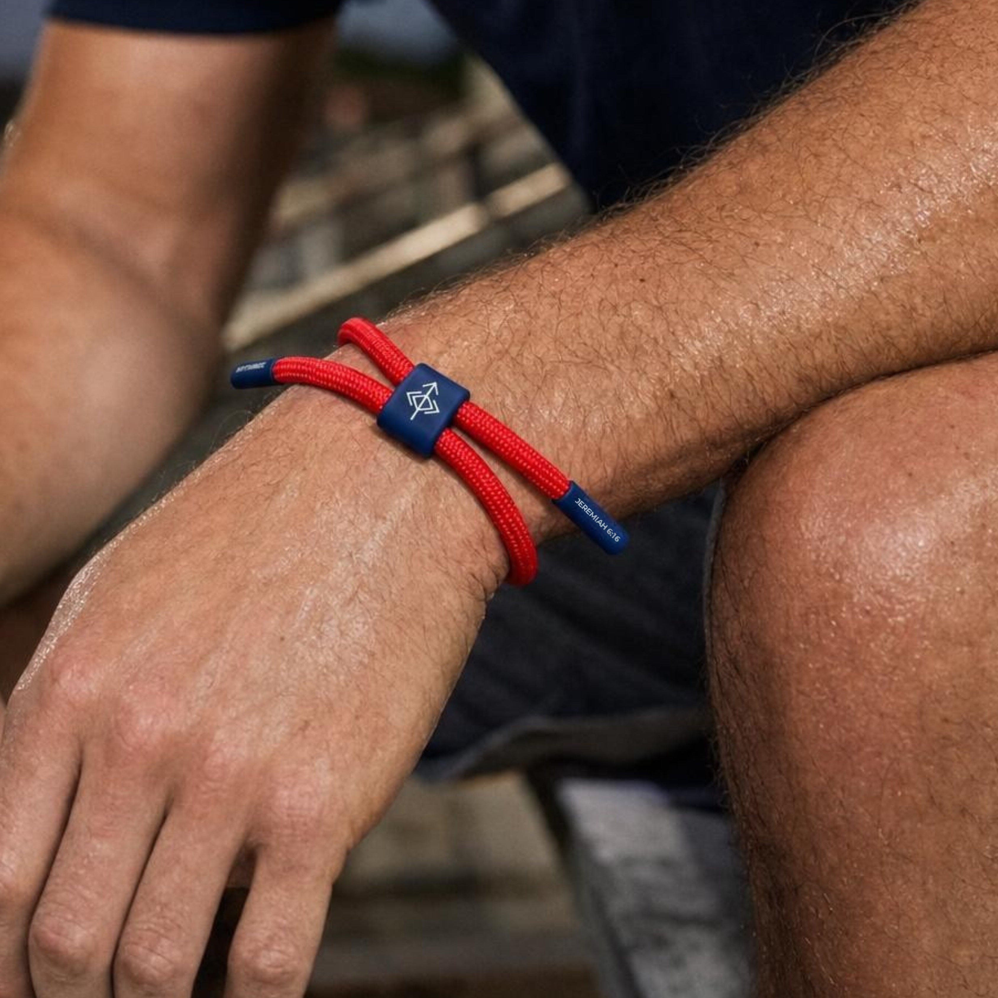 Seek Wisdom bracelet with red cord and navy accents featuring Jeremiah 6:16 verse packaging